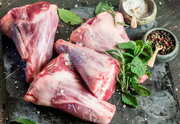 4 legs of lamb on slate board