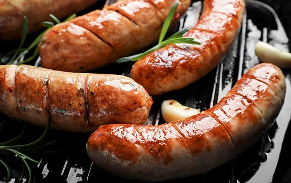 sausages and garlic on the grill